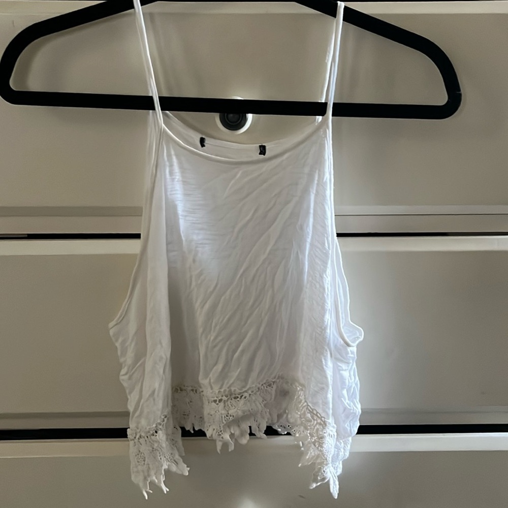 white flowy tank with lace hem